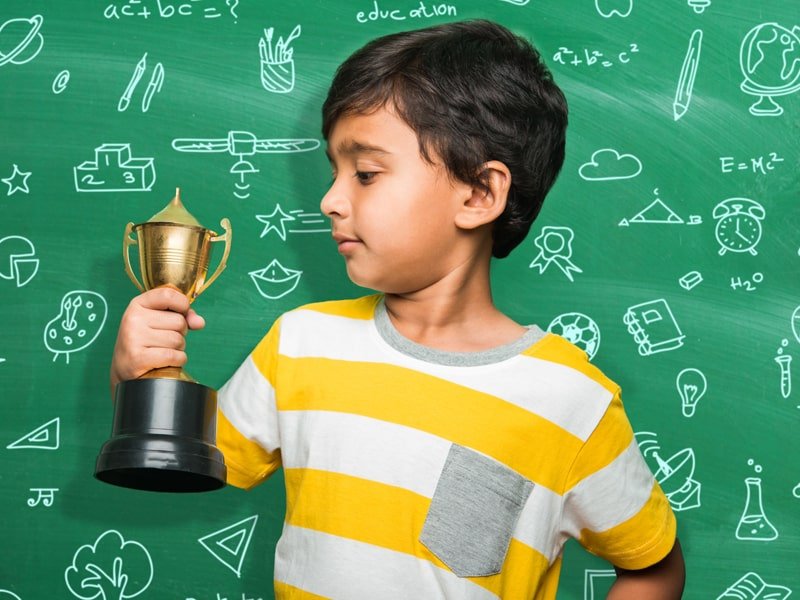 Little boy with award